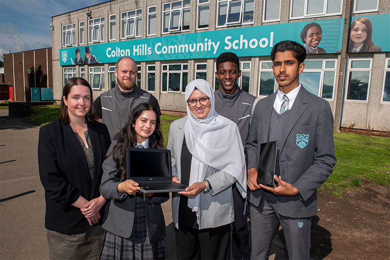 Back from left, James Kennedy and Gareth Williams, both from REPC Ltd.  Front from left, Colton Hills Community School headteacher Julie Hunter, Year 7 pupil Shreya, aged 12, Councillor Obaida Ahmed, Cabinet Member for Digital and Community at City of Wolverhampton Council and Year 10 pupil Shawaiz, aged 15.